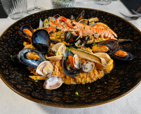 Piatto di pasta con astice della cucina di mare di Anima e Cozze